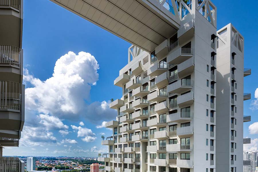 Singapore skyline with modern residential condominiums, illustrating pricing differences between new launch and resale condos